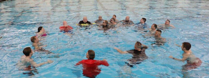 Mike Hudson and water rescue instructors in pool